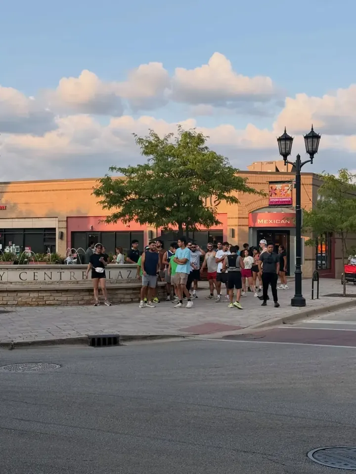 The group gathered on the plaza at golden hour