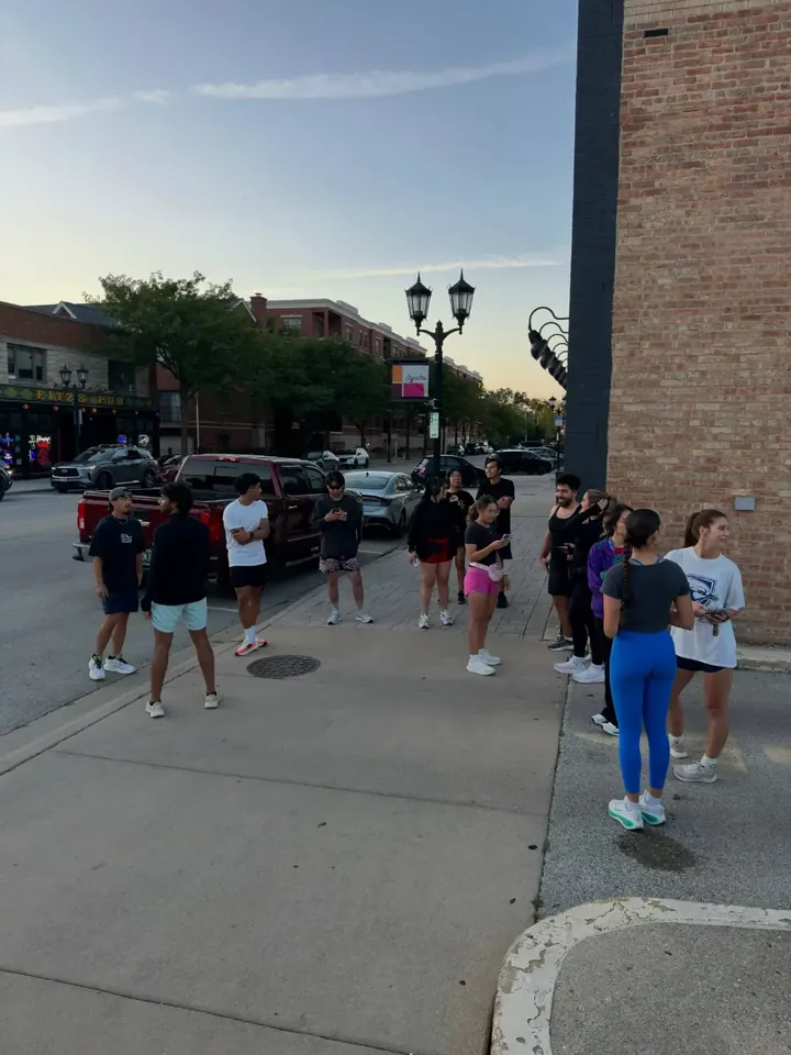 The group gathering downtown at dusk
