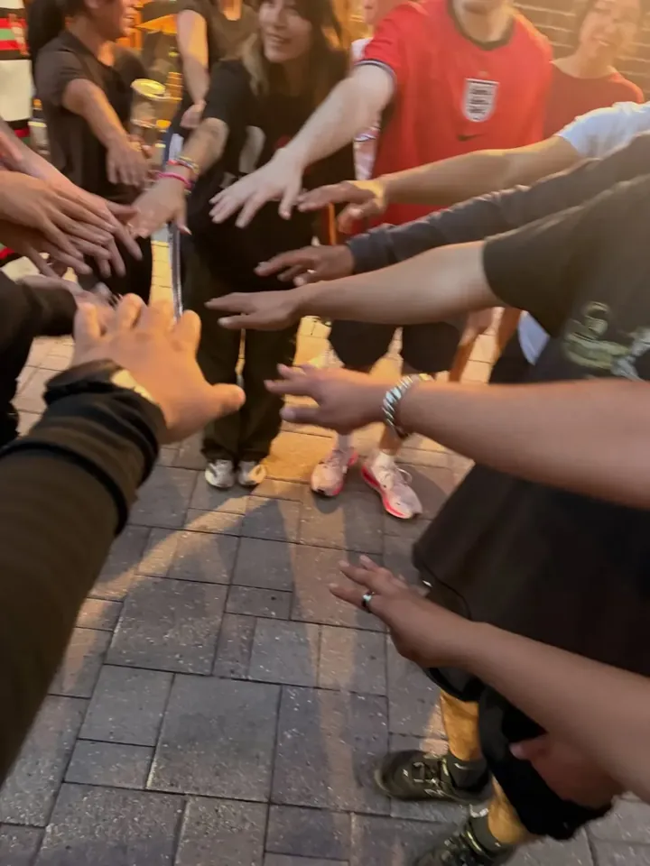 Runners stacking hands in a circle