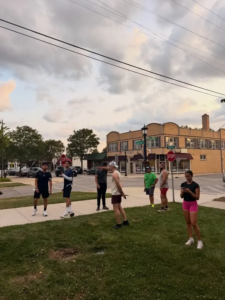 The group gathered on a corner lawn downtown